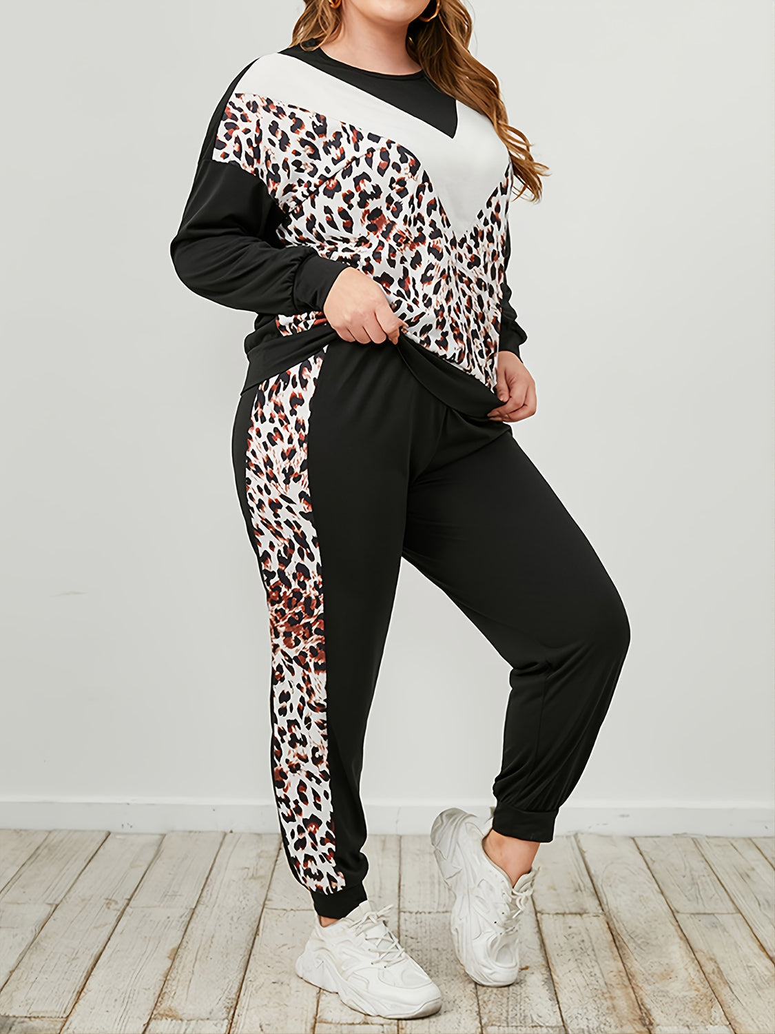 Plus Size Leopard Sweatshirt and Sweatpants Set - Premium Activewear from 5th & Barnett Online Boutique - Just $32.99! Shop now at 5th & Barnett Online Boutique