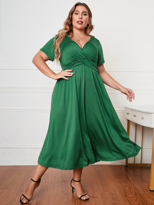 Plus Size Short Sleeve Surplice Neck Midi Dress - Premium Dresses from 5th & Barnett Creative Fashions - Just $35.99! Shop now at 5th & Barnett Creative Fashions 