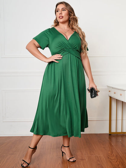 Plus Size Short Sleeve Surplice Neck Midi Dress - Premium Dresses from 5th & Barnett Creative Fashions - Just $35.99! Shop now at 5th & Barnett Creative Fashions 